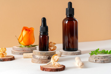 Cosmetics containers decorated with orange rose petals