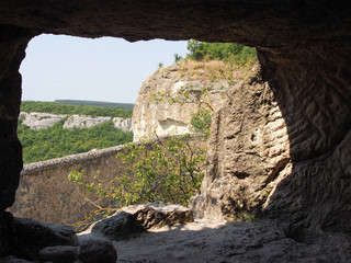 Cave city in the mountains, view of the mountain slopes from the cave.