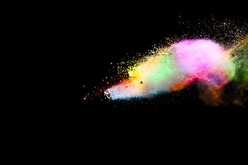 Abstract powder splatted background. Colorful powder explosion on black background. Colored cloud. Colorful dust explode. Paint Holi.