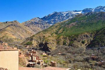 Fototapeta na wymiar Berber villages and houses made out of clay at the hills and mountains of High Atlas 