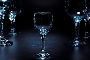 Empty  glasses for drinks on dark background