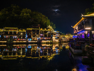 fenghuang,Hunan/China-16 October 2018:Tourist walking in the evening of  fenghuang old town.phoenix ancient town or Fenghuang County is a county of Hunan Province, China