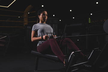 Fototapeta na wymiar athletic african american sportswoman exercising in gym