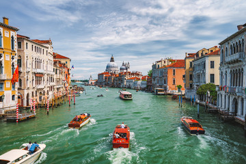 Venice, Italy. Beautiful view of Grand Canal, tourist boats and Basilica Santa Maria della Salute in background
