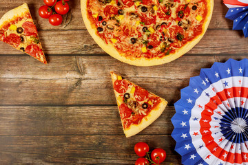 Pizza party for american holiday on wooden table.