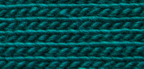 Woolen fabric, front surface, from yarn for knitting green, background. .Emerald background