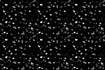 Abstract background picture with white hearts on a dark canvas. Festival of random falling and spinning confetti.