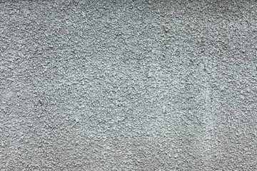 Abstract texture of an old gray concrete wall. Plastered cement surface for background and design. Grunge and craquelure cracked structure.
