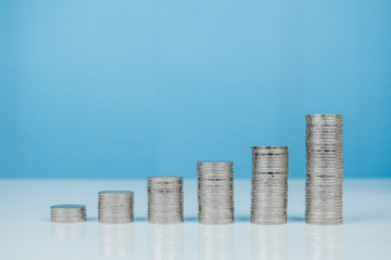 Money stack profit growth on white desk, increase investment and profits, finance and business...