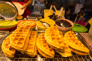 Tasty sweet waffles in street food.