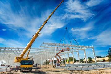 Hall under construction with big crane