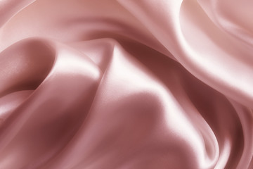 Satin pink silk background, close-up