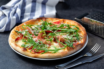 Yummy pizza with green vegie toppings