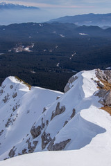 Fototapeta na wymiar Mountain cliff covered in snow