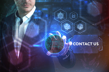 Business, Technology, Internet and network concept. Young businessman working on a virtual screen of the future and sees the inscription: Contact us