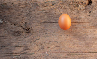 Top view an egg on wooden background.