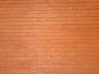 Fototapeta premium Wooden background. Texture of wood. The wall of a wooden house made of timber.