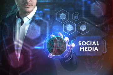 Business, Technology, Internet and network concept. Young businessman working on a virtual screen of the future and sees the inscription: Social media