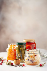 Fermented preserved vegetables food concept. Glass jars with fermented, pickled and canned...