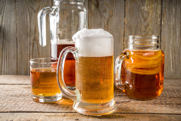 Homemade Kombucha beer, with Kombucha jars on wooden background