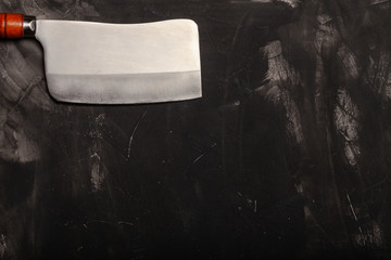 Chopping knives on a dark table. Space for text