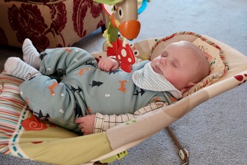 Baby sleeping in bouncer