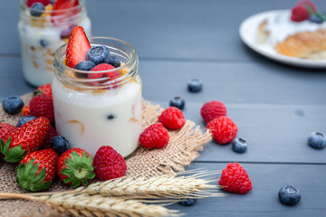 Jar of Yogurt with berry on top