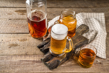 Homemade Kombucha beer, with Kombucha jars on wooden background