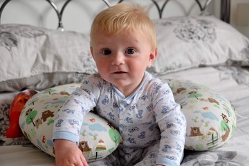 Baby smiling on Bed