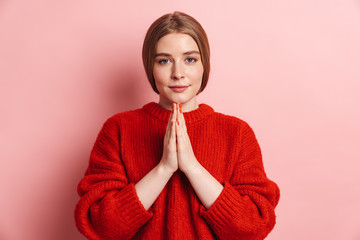 Photo of pleased nice woman holding palms together