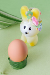 easter celebration concept. toy bunny and egg  on grass. happy easter and spring project.