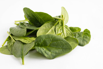 bunch of spinach leaves on a white background