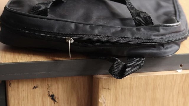 zipping up the first aid kit