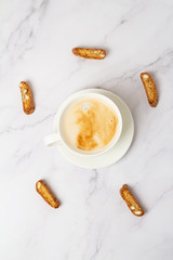 cup of coffee and cookies with nuts top view