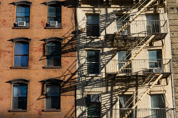 Old Colorful Brick Buildings with a Fire Escape in Chelsea of New York City