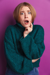Photo of shocked woman expressing surprise and looking at camera