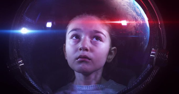 Close Up 4K Shot Of The Beautiful Little Girl Astronaut In Space Helmet. She Is Exploring Outer Space In A Space Suit. Science And Technology Related 4K Concept Footage.