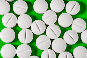 White medical pills and tablets with bottle