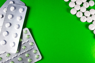 White medical pills and tablets with bottle