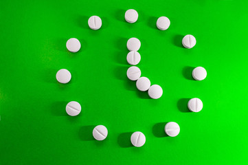 White medical pills and tablets with bottle