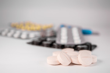 White medical pills and tablets with bottle