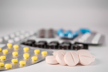 White medical pills and tablets with bottle
