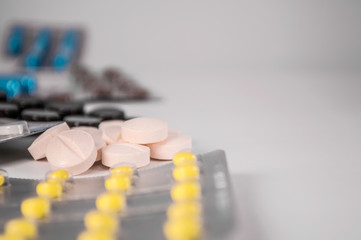 White medical pills and tablets with bottle