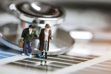 Mini Figure people or tourist man wearing surgical mask protective Coronavirus 2019-ncv, Chinese coronavirus outbreak WUHAN virus concept, flu virus prevention infectious and stethoscope medical