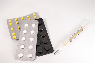 White medical pills and tablets with bottle