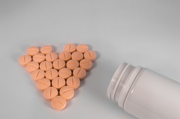 White medical pills and tablets with bottle