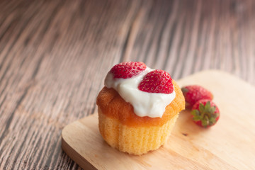 Pieces of strawberry cake on wooden plate, bakery and food.