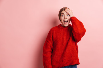 Photo of excited beautiful woman expressing surprise and screaming