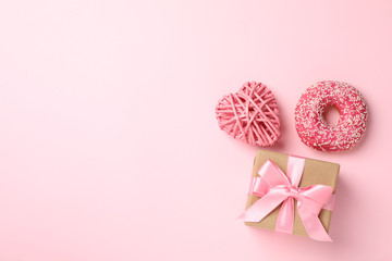 Gift box, donut and heart on pink background, space for text