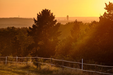 Beautiful countryside landscape with forest durin sunset. View to Nuremberg from Haimendorf.